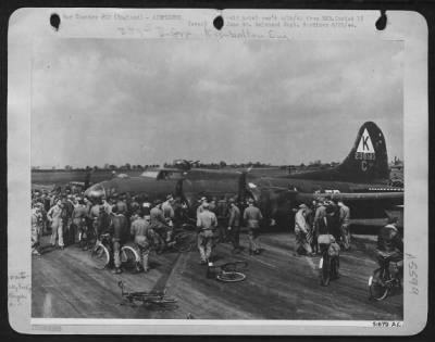 Battle Damage > Minus wheels, a Boeing B-17 Flying ofrtress made a perfect belly landing. Members of a ofrtress Station in England look her over to see how the "big fellah" took it. A few days in the hands of the ground mechanics and it will be over Germany again.