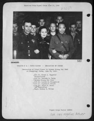 Ceremonies & Decorations > Decoration Of Tokyo Flyers By Madame Chiang Kai Shek At Chungking, China, June 29, 1942. 1St. Lt. Frank A. Kappeler, Unidentified, 1St. Lt. Kenneth E. Reddy, Madame Chiang Kai Shek, 1St. Lt. Lucian N. Youngblood, 1St. Lt. Eugene F. Mcgurl, 1St. Lt. Jacob