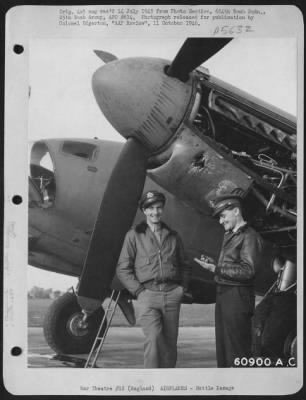 Battle Damage > Lt. Tunnel And Lt. Mccarthy Of The 654Th Bomb Squadron, 25Th Bomb Group, Standing Beside A Flak Damaged De Haviland "Mosquito" Reconnaissance.  England, 4 August 1944.