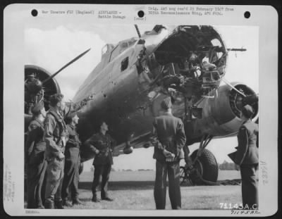 Battle Damage > Men Examine The Boeing B-17 "Flying Fortress" (A/C 890) Of The 379Th Bomb Group Which Was Badly Damaged During A Raid Over Europe.  The Plexiglass Nose Was Completely Shot Away And Many Holes Were Ripped In The Fuselage Of The Plane.  28 June 1944, Englan