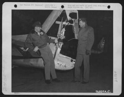 Thumbnail for Battle Damage > Two Officers Of The 364Th Fighter Group, 67Th Fighter Wing, Examine The Damaged Tail Section Of A Plane At The 8Th Air Force Station F-375, Honnington, England.  11 November 1944.