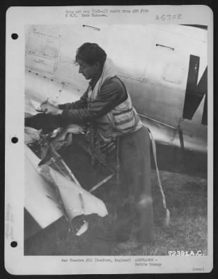 Battle Damage > Pilots Of The 78Th Fighter Group Makes Out His Report After Landing His Battle Damaged Republic P-47 At 8Th Air Force Station F-357 In Duxford, England.  1 July 1944.