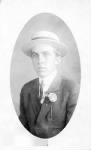 Gordon Van Kleeck wearing straw hat