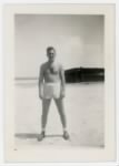 William E. Prettyman in shorts on a beach on the Kwajalein Atoll