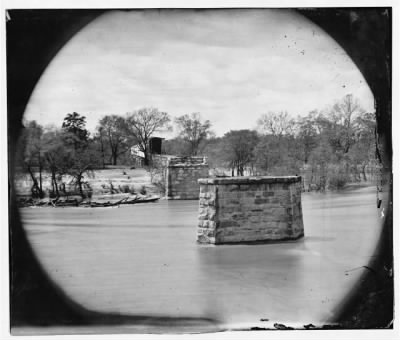 1702 - Richmond, Va. Ruins of Richmond & Danville Railroad bridge; the city beyond