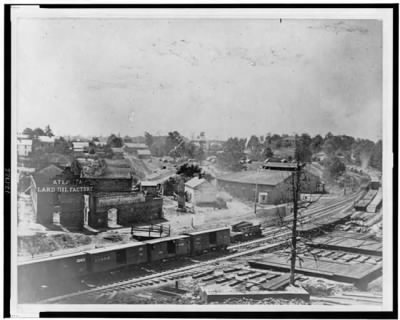 2166 - View of Atlanta, Georgia, with railroad cars in left foreground