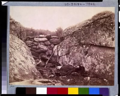 2456 - Battle-field of Gettysburg--Dead Confederate sharpshooter at foot of Little Round Top [i.e., Devil's Den]