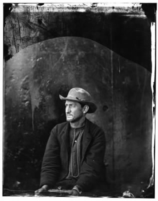 3151 - Washington Navy Yard, D.C. Edman Spangler, a 'conspirator,' in hat and manacled