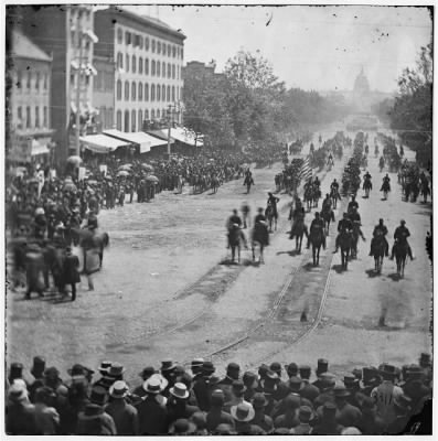 4290 - Washington, District of Columbia. The Grand Review of the Army. Artillery unit passing on Pennsylvania Avenue near the Treasury