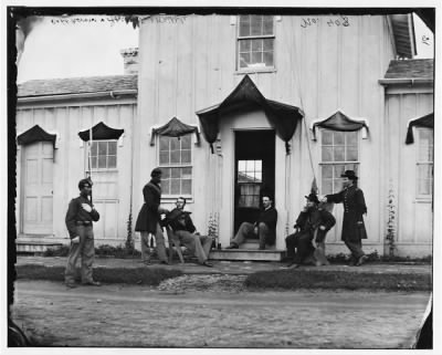 4599 - Arlington, Va. Capt. Nevins and officers in front of headquarters, Fort Whipple; mourning crepe drawn over doors and windows