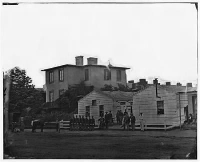 5019 - [Washington, District of Columbia]. Eight soldiers in formation in front of temporary buildings