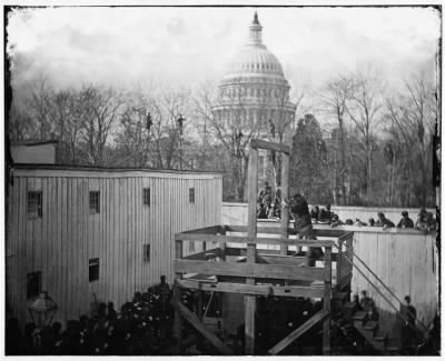 673 - Washington, D.C. Soldier springing the trap; men in trees and Capitol dome beyond