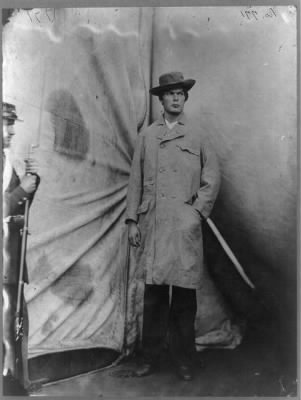 709 - Lewis Payne, Lincoln conspirator, full-length portrait, standing in front of tent, facing right