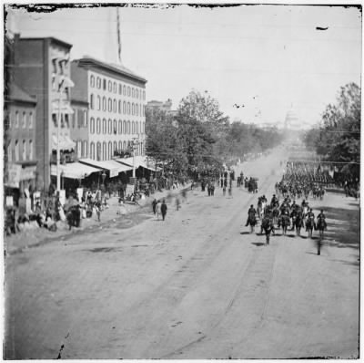 95 - Washington, District of Columbia. Infantry passing on Pennsylvania Avenue near the Treasury
