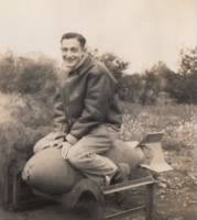 Lt Feinberg sitting on a 500 pound bomb