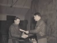 Captain Walter T. Holmes receiving medal from Colonel Johnson