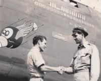 T/Sgt Morton shakes hands with Captain William D. "Doc" Hughes