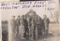 Boys watching Ford's dog, "Trim Tab" in Dispersal Area 43 in 1944