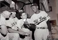 Leroy "Satchel" Paige shows grip to Mantle, Reynolds, Dimaggio