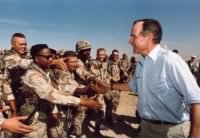 President Bush talks with the troops in Saudi Arabia