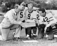 1938: Coach with his players