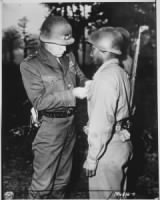 480px--Lt._Gen._George_S._Patton,_U.S._Third_Army_commander,_pins_the_Silver_Star_on_Private_Ernest_A._Jenkins_of_New_York_Cit_-_NARA_-_535724.jpg