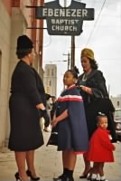 Coretta Scott King and her daughters, Yolanda and Bernice, talk with a fellow parishioner outside Ebenezer Baptist Church in Atlanta..jpg