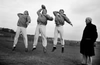 Bobby Thomason, Bob Waterfield, and Norm Van Brocklin during a practice session with Coach Clark Shaughnessy of the Los Angeles Rams.jpg