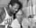 Bill Russell holds Auerbach under a shower.jpg