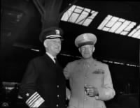 Admiral Stark and General Eisenhower awaiting President Truman.jpg