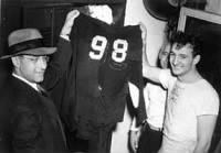 Tom Harmon & Fritz Crisler holding torn jersey.jpg