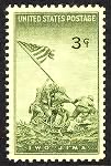 Marines raise flag on Iwo Jima and Mt Suribachi.gif