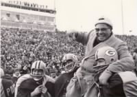 Lombardi is carried off the field by linebacker Dan Currie, center, and defensive tackle Dave Hanner.jpg