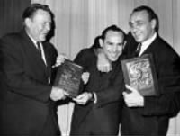 Ralph Houk, left and Andy Robustelli gang up on Yogi Berra.jpg