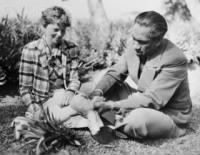 Duke Kahanamoku Eating Pineapple with Amelia Earhart..jpg