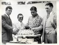 Joe Louis with Jimmy Braddock, Tony Canzoneri and Tommy Loughran cutting Louis' birthday cake..jpg