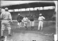 Frank Isbell of White Sox and Johnny Kling of Cubs, standing in the foul zone behind home plate. 1905.jpg