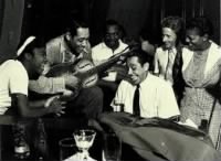 Sister Rosetta Tharpe on the left, Duke Ellington pretending to play Rosetta's resophonic guitar, and Cab Calloway at the piano..jpg