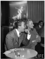 singer-mel-torme-and-model-june-bright-laughing-sitting-at-the-table-in-the-hollywood-nightclub-listening-to-dizzy-gillespie-22bebop22-king.jpeg