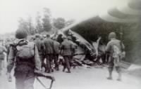 Marching German prisoners through the remains of a Horsa glider..JPG
