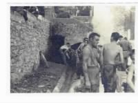 Washing off a little battle sweat and dirt at a Normandy spring.  Edward Short on right with back to camera.JPG