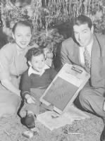 Joe-DiMaggio-and-Dorothy-Arnold-Under-Christmas-Tree-with-Joe-Jr..jpg