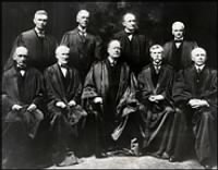 from left, William R. Day, Joseph McKenna, Chief Justice Edward D. White, Holmes and Willis Van Devanter, and, standing, from left, Louis D. Brandeis, Mahlon Pitney, James C. McReynolds and John H. Clarke..jpg