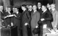 Chicago restauranteur Charles Weeghman, fifth from the left, passes a check for $500,000 to J.G. Wakefield of the Corn Exchange National Bank in January 1916, thereby taking over ownership of the Cubs..jpg