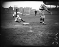 Charlie Grimm slides safely into third base, circa April 20, 1933.jpg