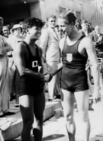 Richard Degener (Olympic Champion 1936) and Japanese Shibahara shake hands because of Degener's Olympic victory..jpg