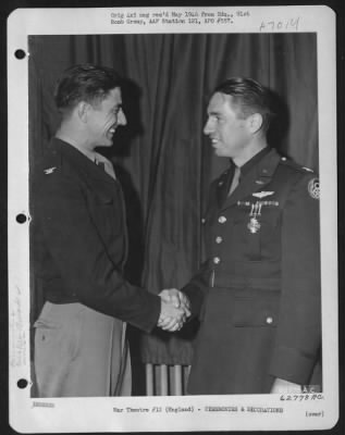 Awards > Colonel Terry, Group Commanding Officer, Congratulates Capt. Hudson After Presenting Him With The Distinguished Flying Cross.  91St Bomb Group, 8Th Air Force, England.  16 June 1944.