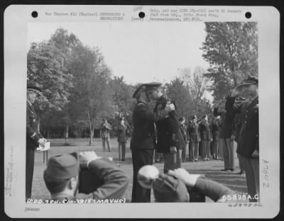 Awards > A French Officer Embraces Brig. Gen. William M. Gross, Commanding General Of The 1St Combat Wing, After Presenting Him With The Croix De Guerre During A Ceremony On 3 May 1945 At 1St Air Division, Brampton, England.