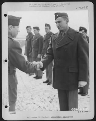 Awards > Colonel Rimerman Congratulates Lt. Arnold Of The 353Rd Fighter Group After Awarding Him The Air Medal Somewhere In England, 30 December 1944.