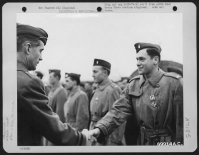 Awards > Lt. Cohan Of The 490Th Bomb Group Is Awarded The Distinguished Flying Cross By Major General Earle E. Partridge At An 8Th Air Force Base In England.  12 February 1945.